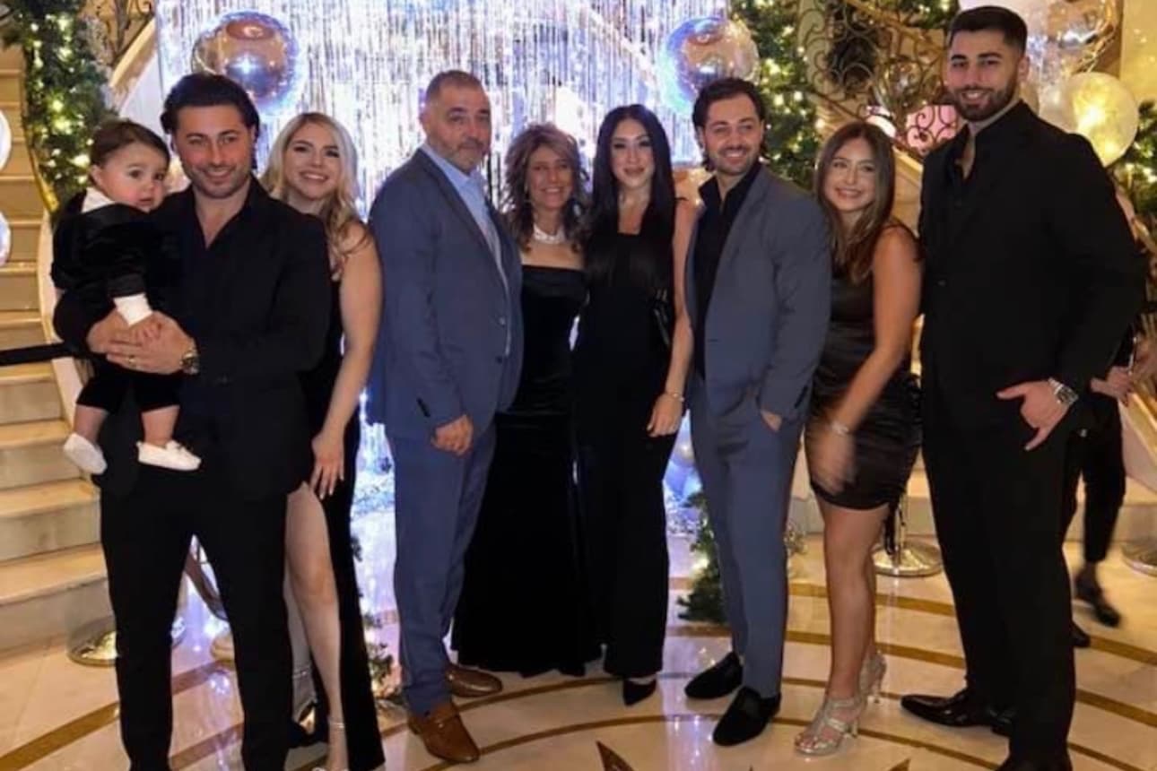 Family gathering in elegant attire for a celebration.